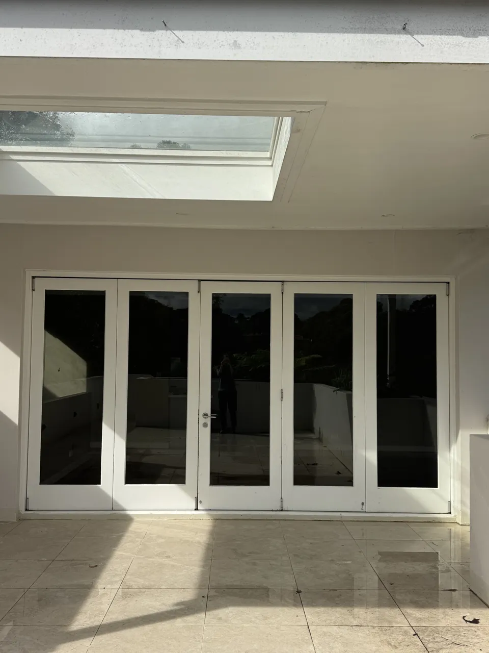 Old timber bifold doors seen from the deck