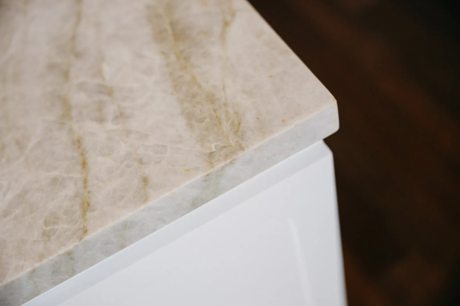 Stone edge against dark timber floor