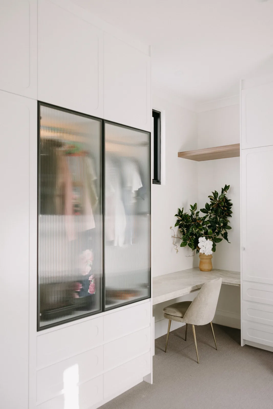 Fluted glass panel in the walk-in robe